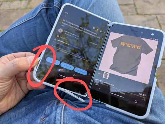 A foldable phone with the white rubber bumper peeled off most of the bottom left half and coming loose up the left side (North of which I circled in red). The phone is open on my lap, with the left half showing an email and the right half showing a tee shirt at my Threadless store.