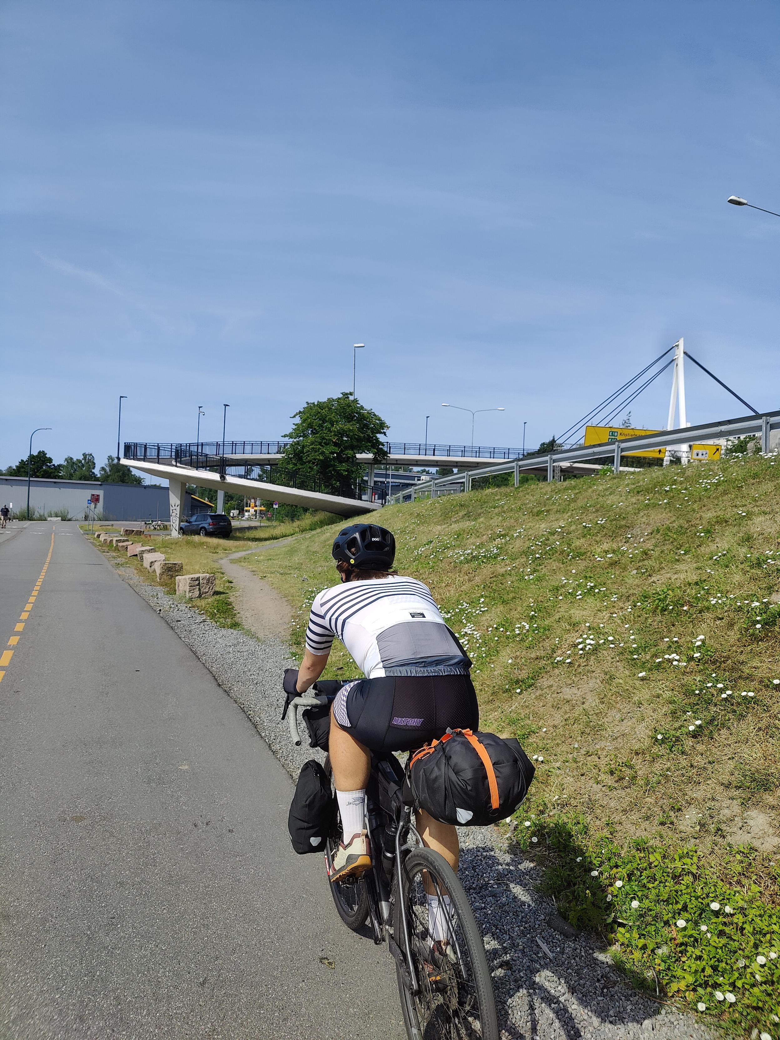 Cyclist on bicycle track leaving Oslo.