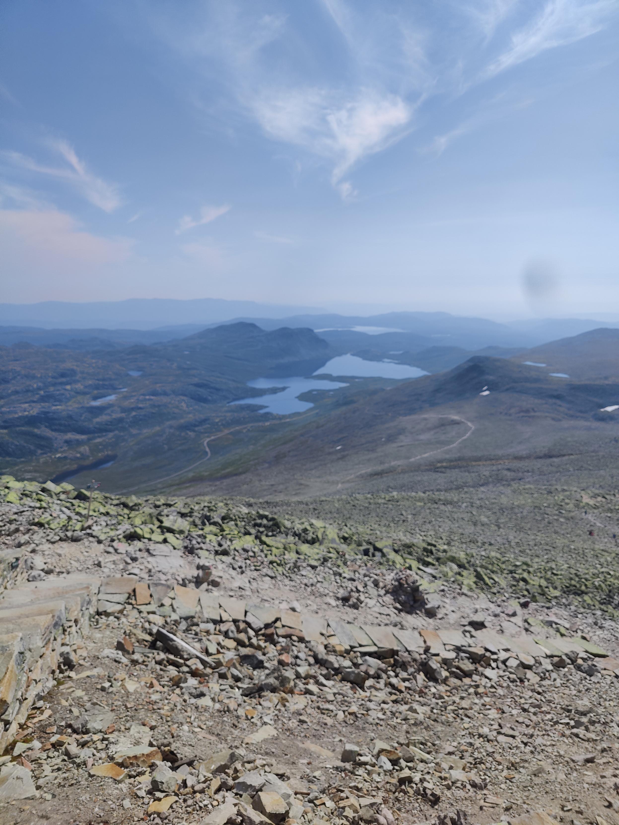 The view from Gaustatoppen, showing some lakes, a trail and the road to Sauland.